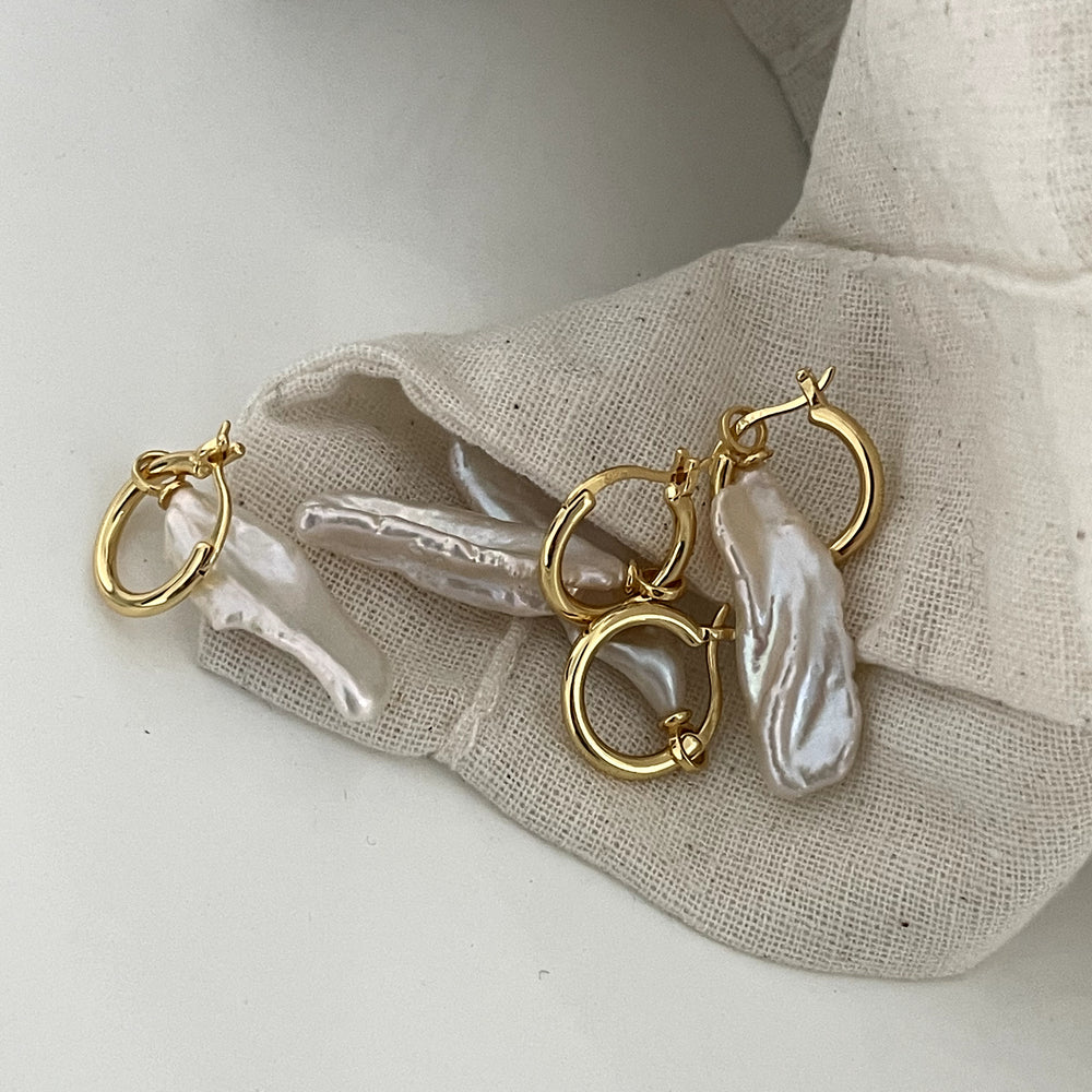 
                      
                        Intellectual Natural Loquat Pearl Earrings
                      
                    