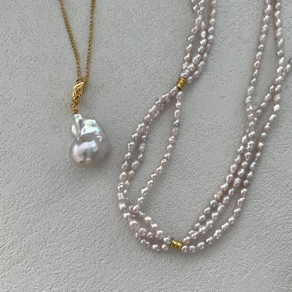 
                      
                        Triple-Strand Natural Pearl Necklace
                      
                    