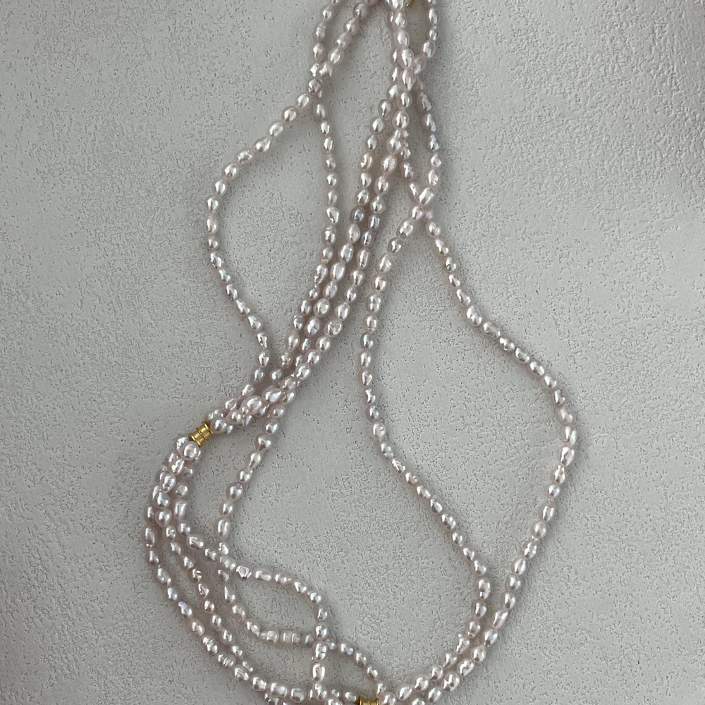 
                      
                        Triple-Strand Natural Pearl Necklace
                      
                    