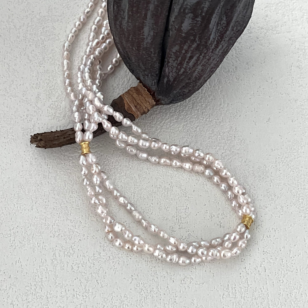 
                      
                        Triple-Strand Natural Pearl Necklace
                      
                    