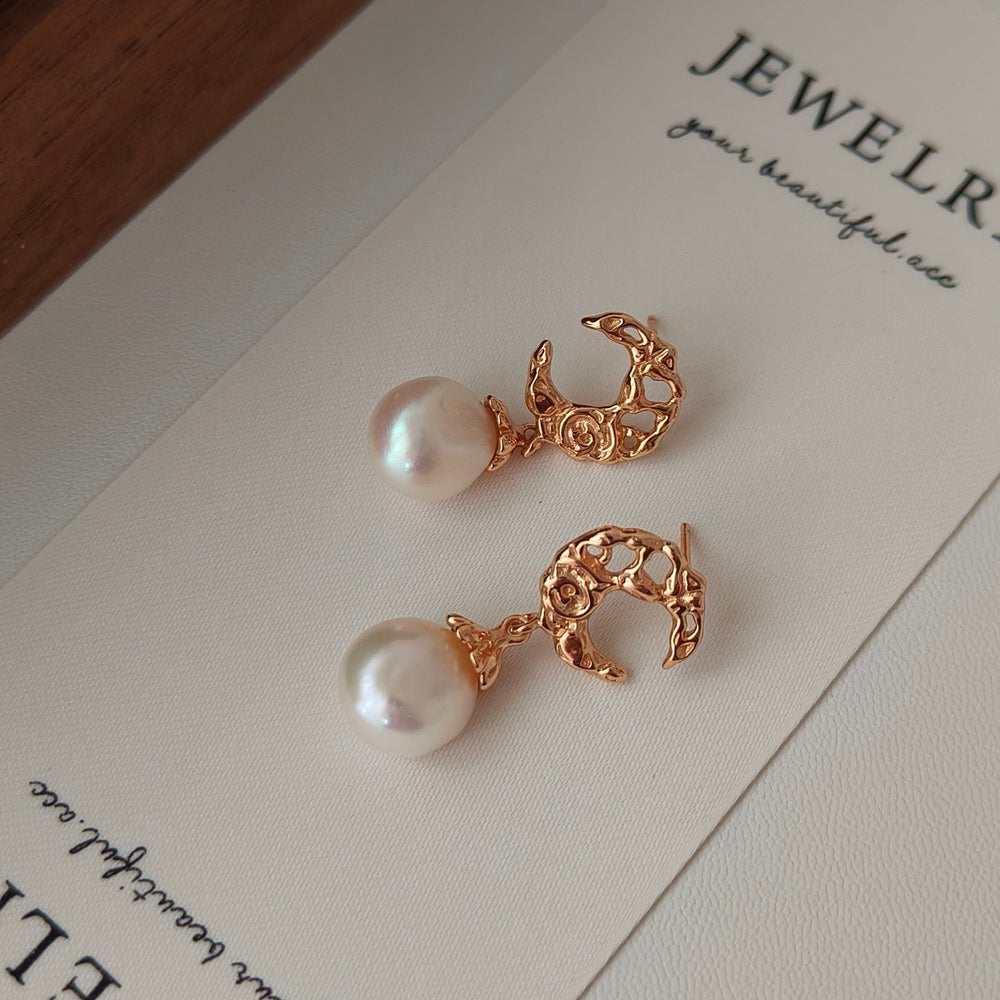 
                      
                        Crescent Hollow Natural Pearl Earrings
                      
                    